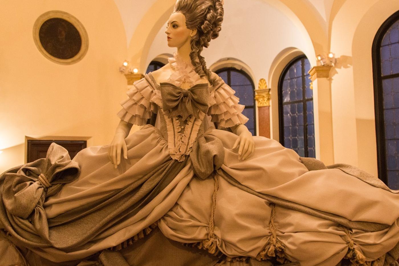 A female mannequin wearing a Victorian-era outfit.