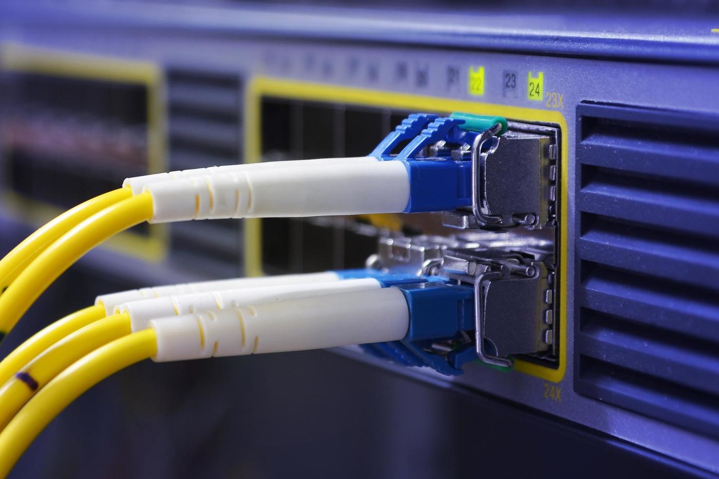Wires connecting to a Wi-Fi router.