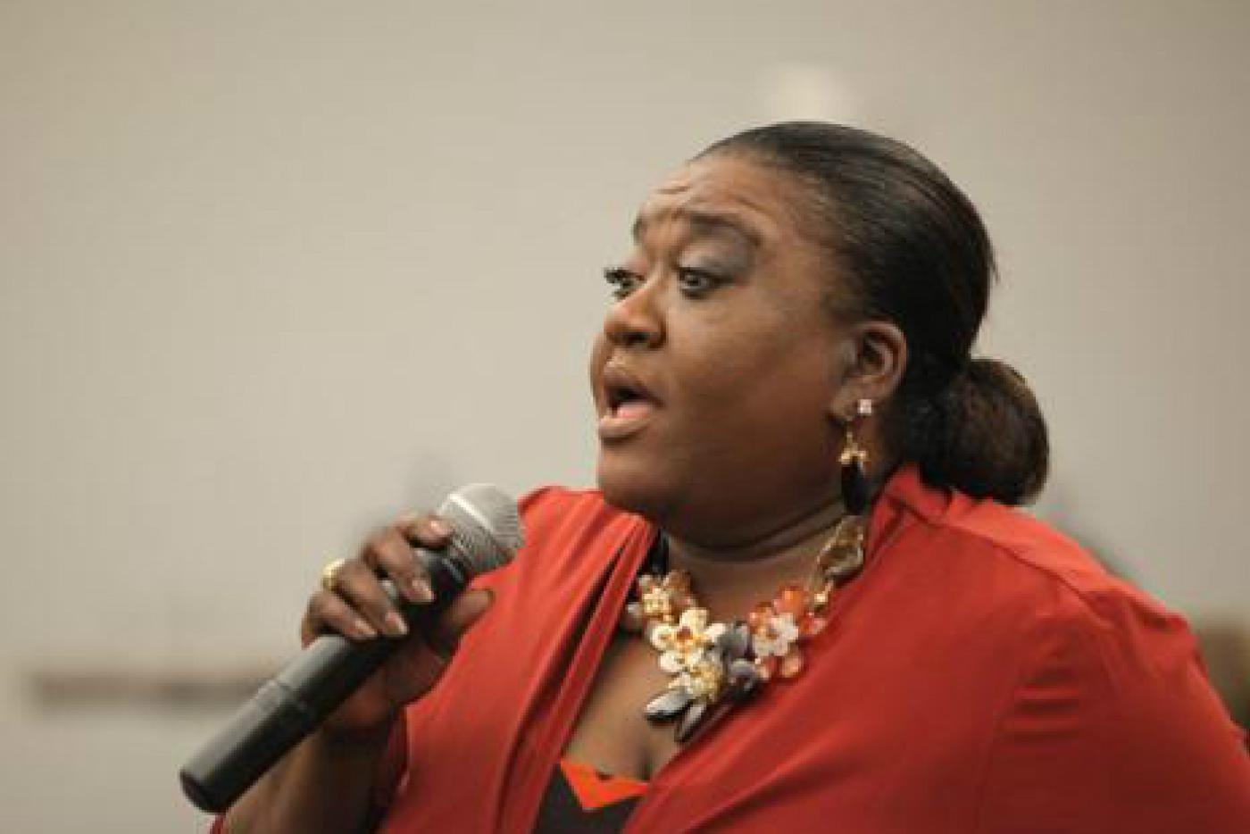 Mary D. Williams speaking into a microphone.