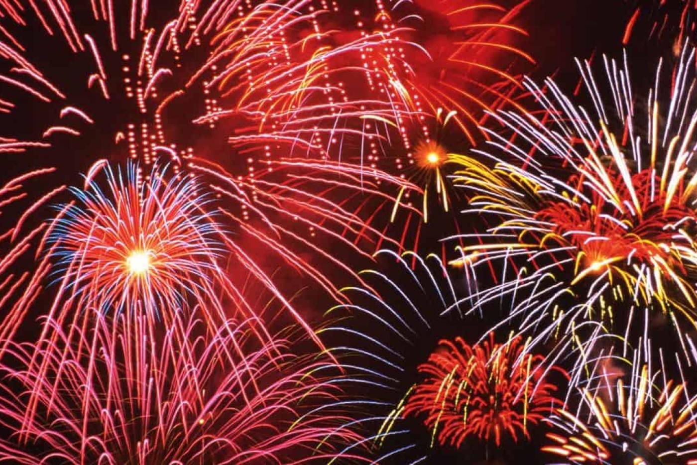 Fireworks going off at night.