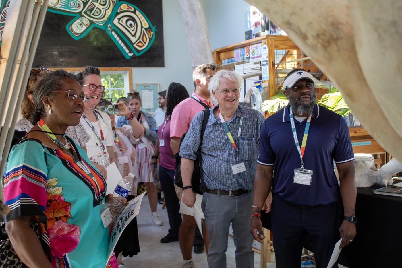 several teachers looking at bones in a museum