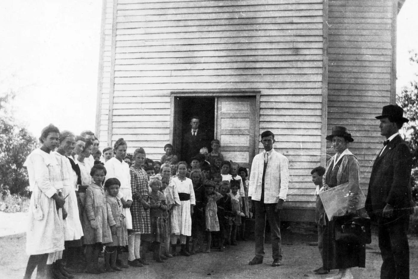 Unidentified Rural School, Showing Children and Health Officers.