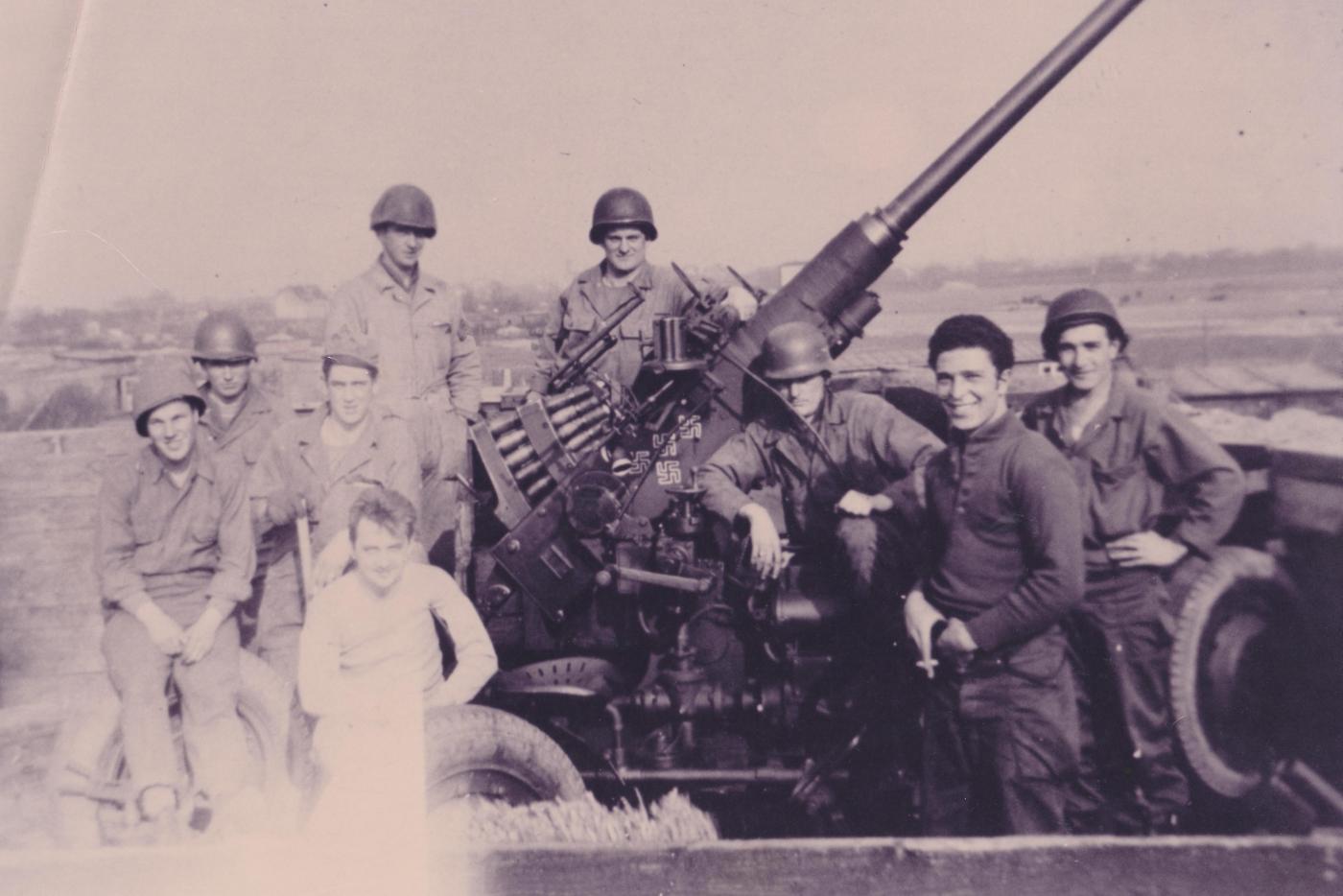 Members of the 559th AAA in Europe posing with their 40mm Bofors Gun after training at Fort Fisher.