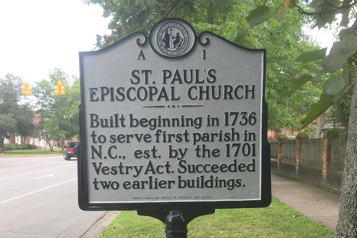 historical marker text reads Built beginning in 1736 to serve first parish in N.C., est. by the 1701 Vestry Act. Succeeded two earlier buildings.