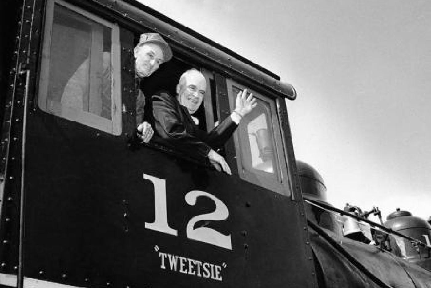 Gov. Luther Hodges waves from the Tweetsie engine in 1956. Image from the N.C. Museum of History