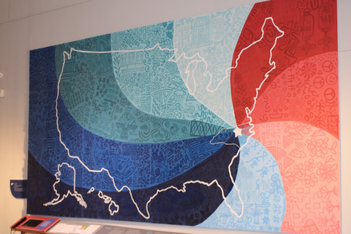 Mural created by artist Adriana Ameigh from participating English language learners’ drawings was the centerpiece of the exhibit, “Patterns of Belonging.”