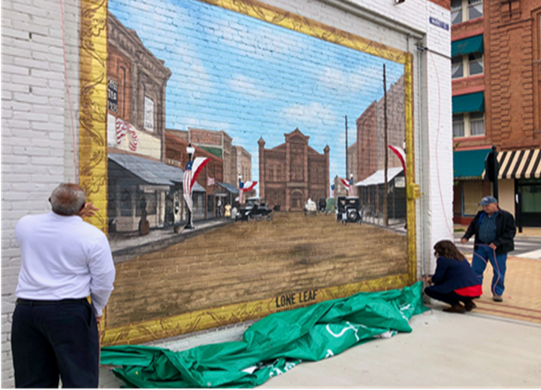 two people look at a mural