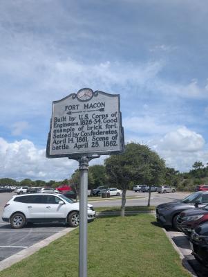 a historic marker sign for Fort Macon