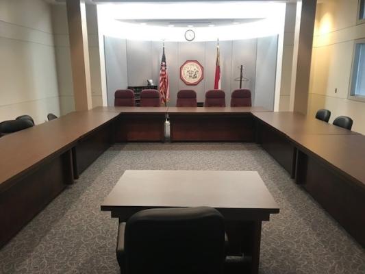 Property Tax Commission hearing room with tables and chairs