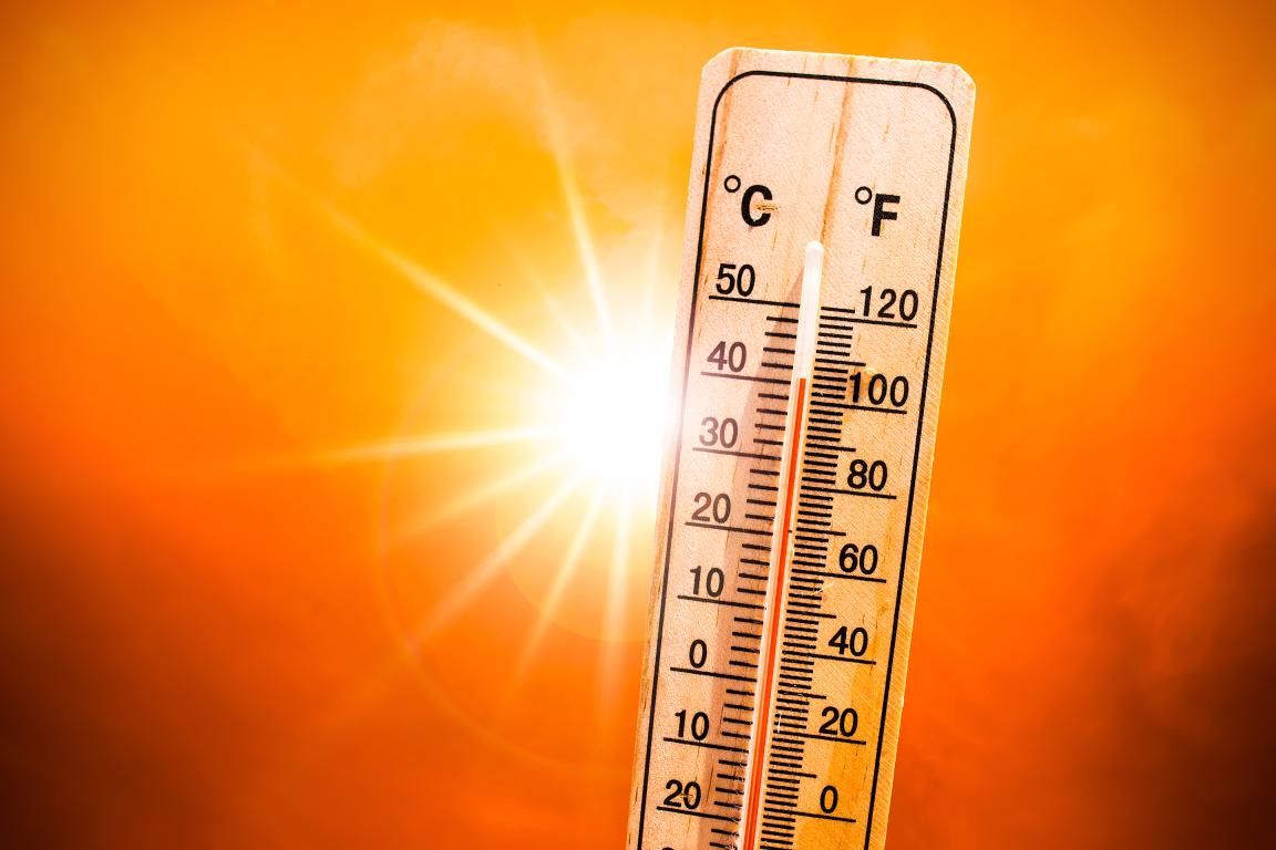A thermometer held up to the sun reads above 100 degrees.