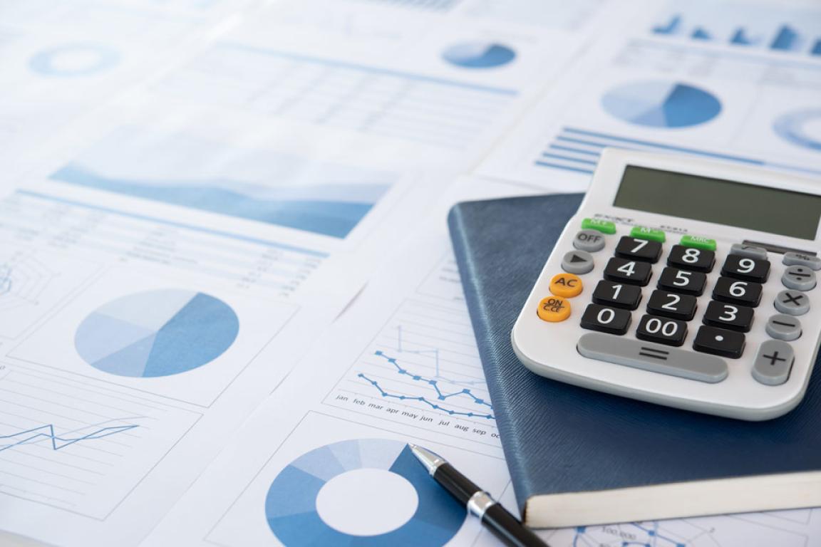 A calculator on top of some graphs