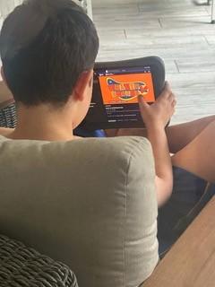 Levi, age 11, watches "Health Heroes," a new educational TV series that teaches kids about public health.