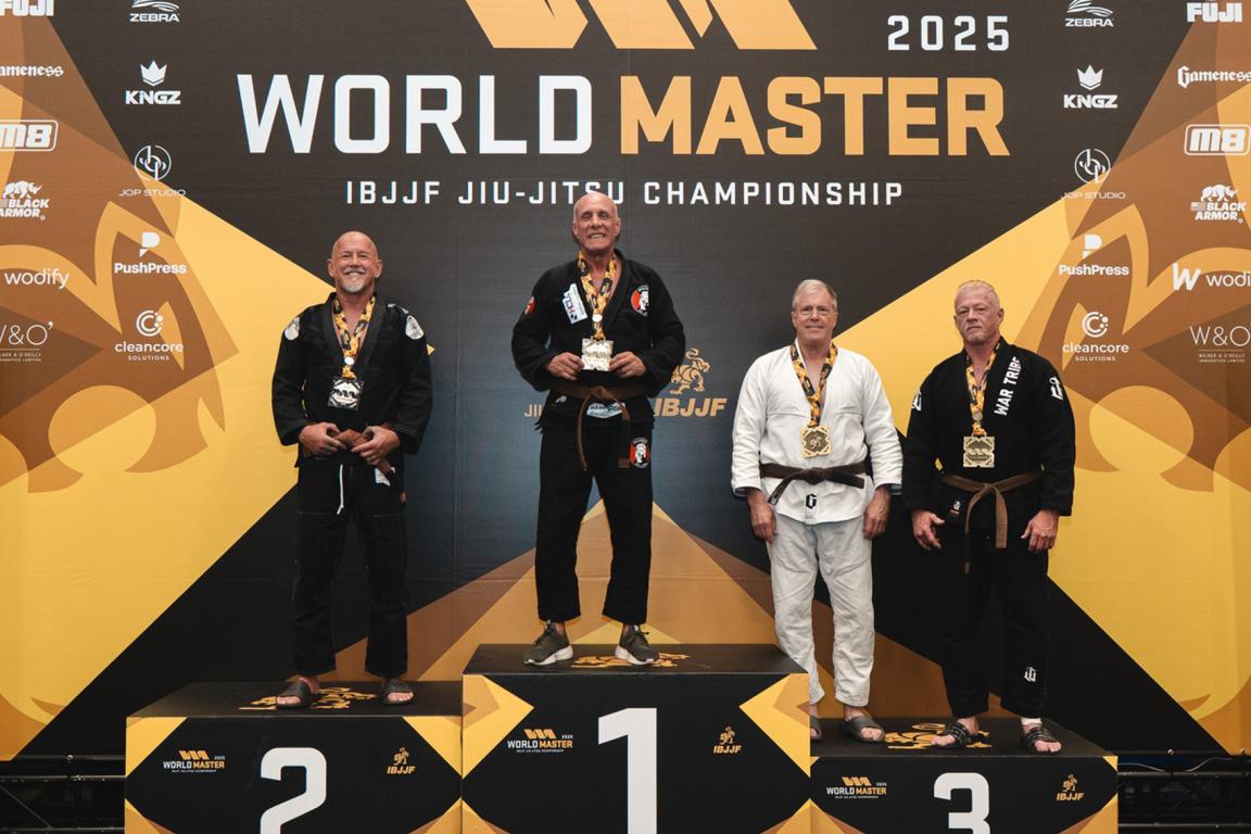 Four medalists stand on the podium at the 2025 World Master IBJJF Jiu-Jitsu Championship
