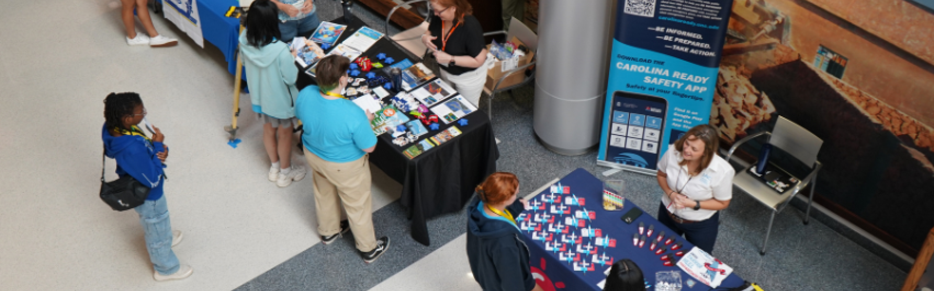 Arial shot of a career fair with campers talking to staff at the booths