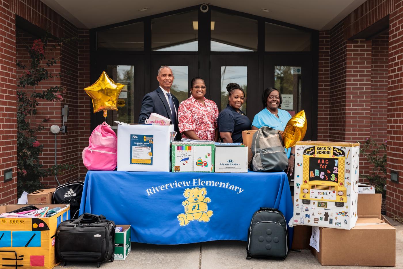 DPS Secretary Eddie Buffaloe at School Supply Drive Drop off with educators