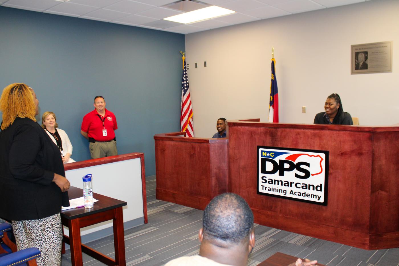 Room where judge sits at front and participants stand or sit at tables in front of the judge's bench.