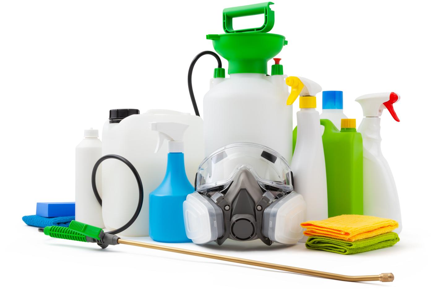 Group of pesticide and chemical containers/sprayers with a safety mask.