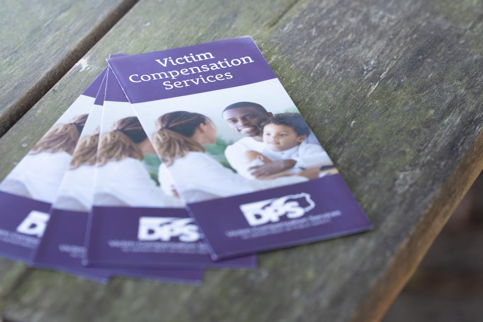 Stack of victim compensation brochures