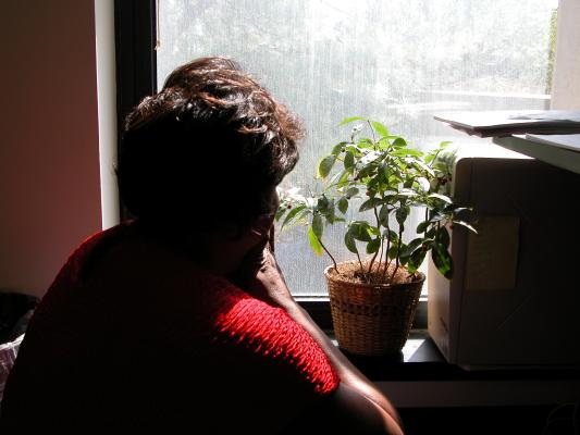 Crime victim looks out the window