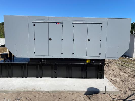 Large generator with maintenance doors.