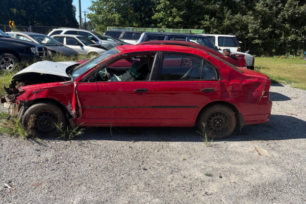wrecked red honda car with front damager