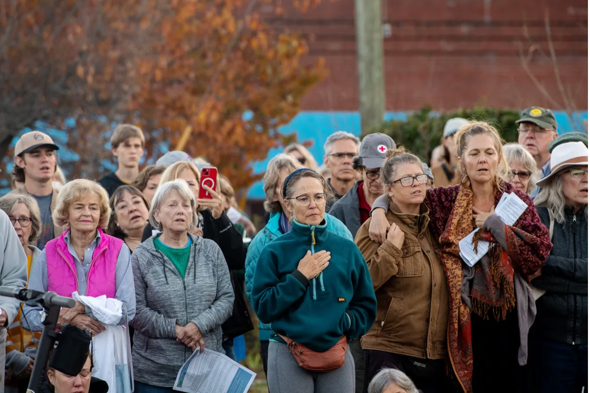 Photo of community members gathered in an outdoor setting