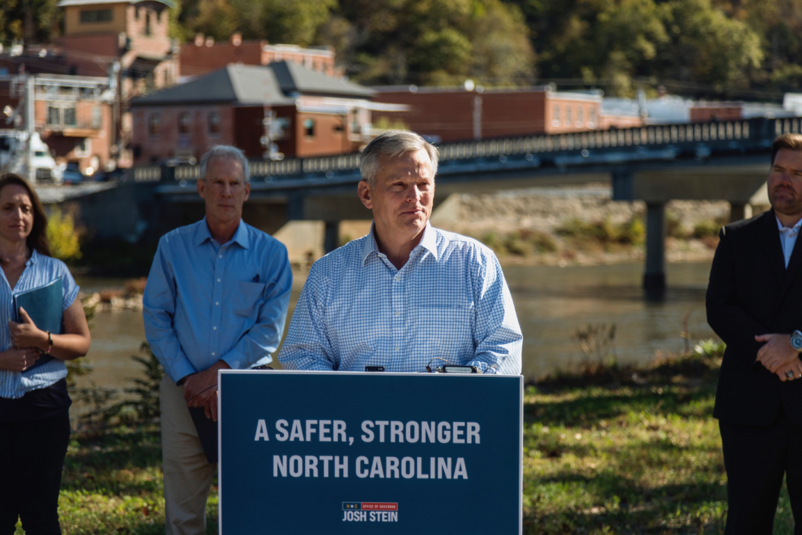 Leaders gather outside to make an announcement