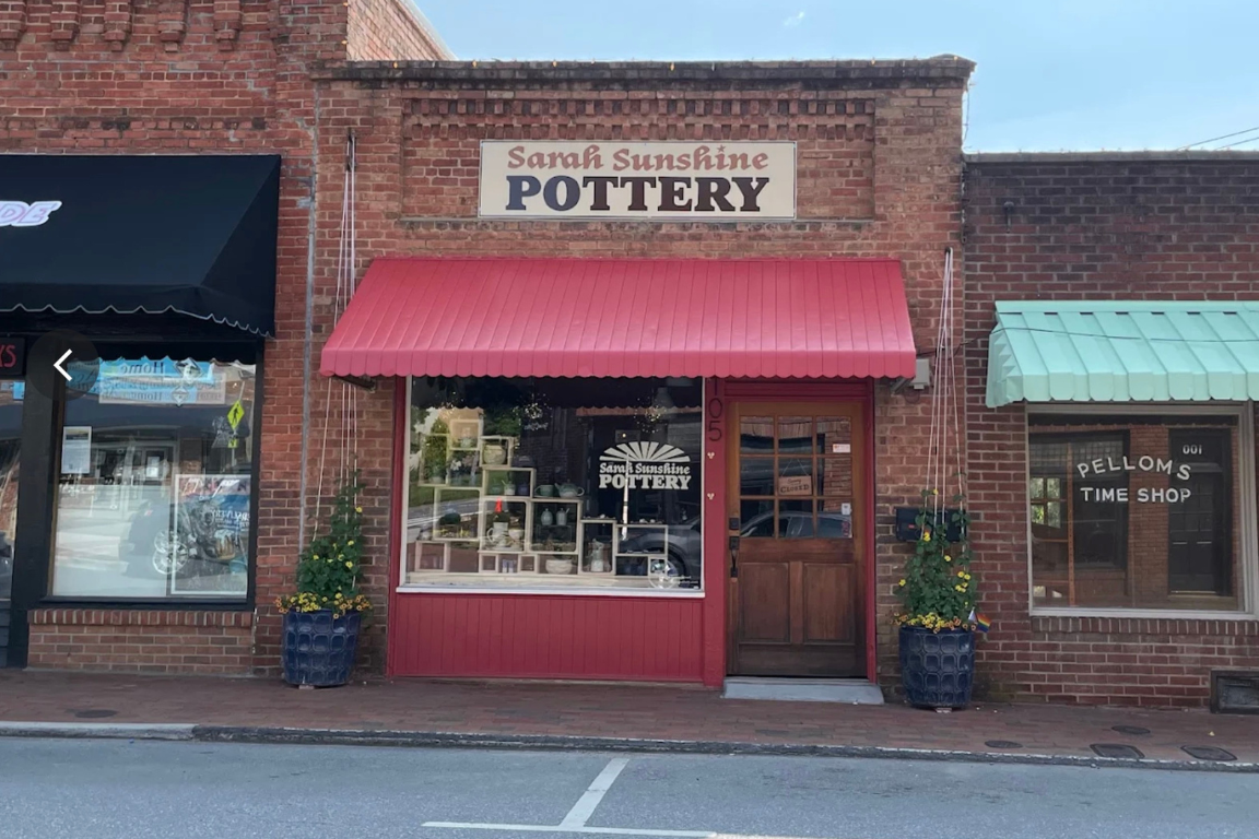 small town storefront with a red awning
