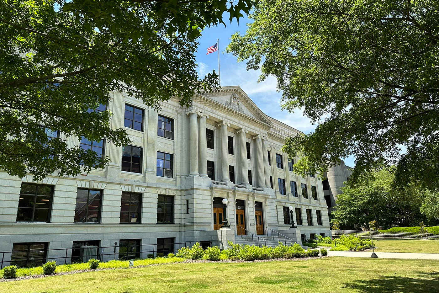 Street view of the front of the Guilford County Old Courthouse on a sunny Spring day.