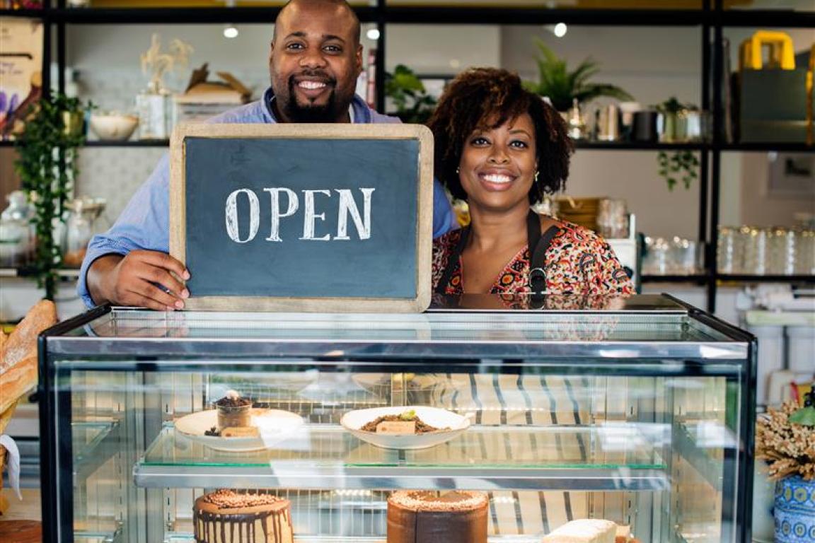 Image of two bakery owners standing in front of the bakery counter