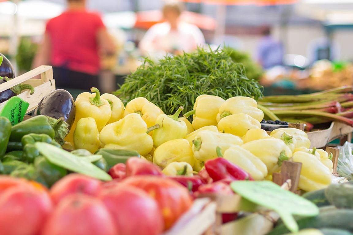 Fresh fruits and vegetables at an open market.