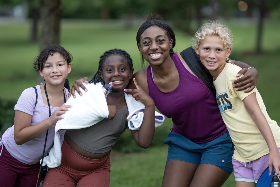 Four girls smiling at the camera