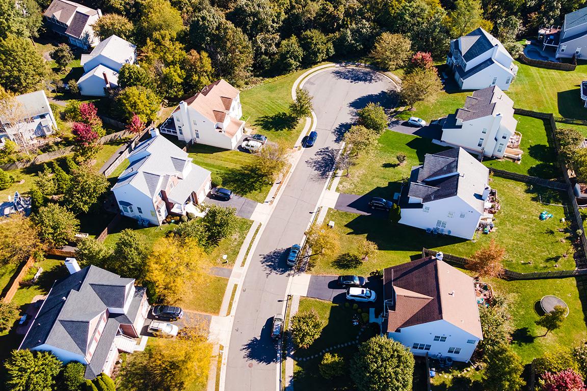 Aerial view of a suburban neighborhood of single family homes.