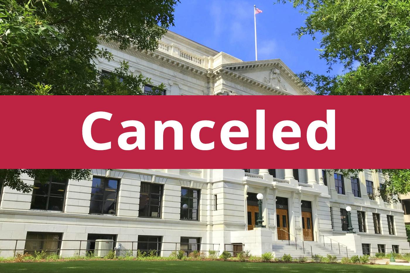 Cancelled banner in front of Old Guilford County Courthouse.