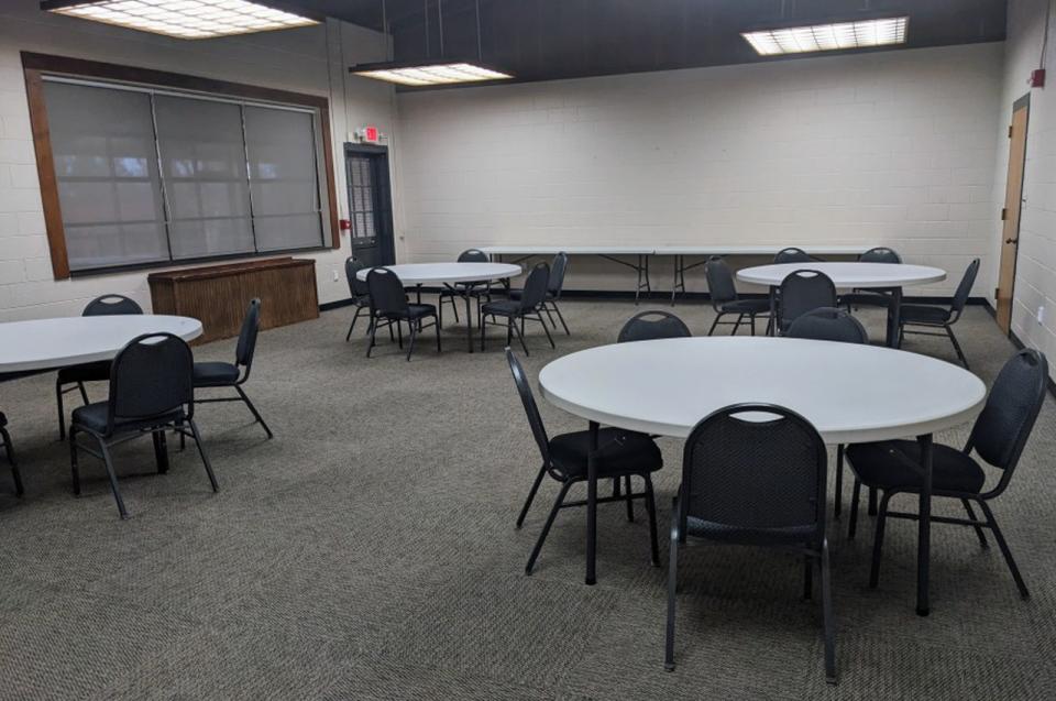 The Guilford Room at the Bur-Mil Park Event Center with tables and chairs.