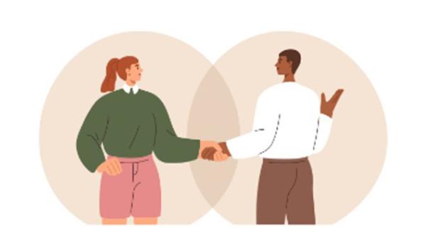 Two people shaking hands.