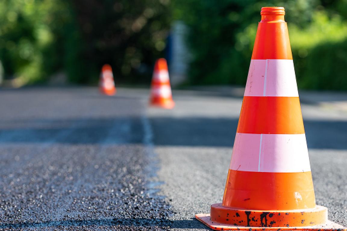 orange traffic cones on a road