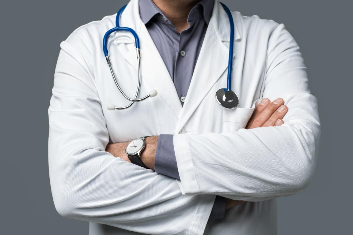 Doctor in coat with stethoscope.