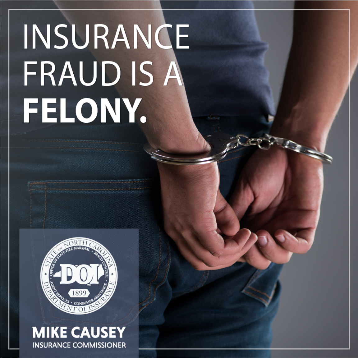 Hands in handcuffs behind someone's back.