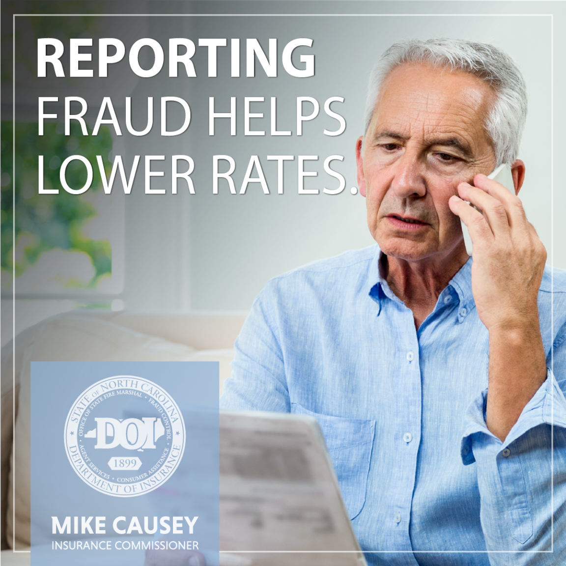 Man on the cell phone looking at a bill or statement paper.