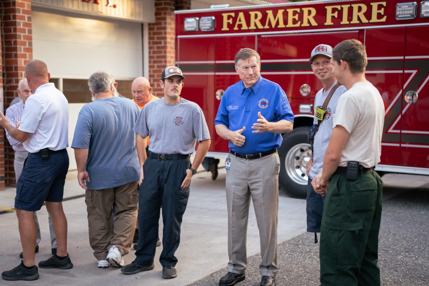 Commissioner Causey talks with fire fighters