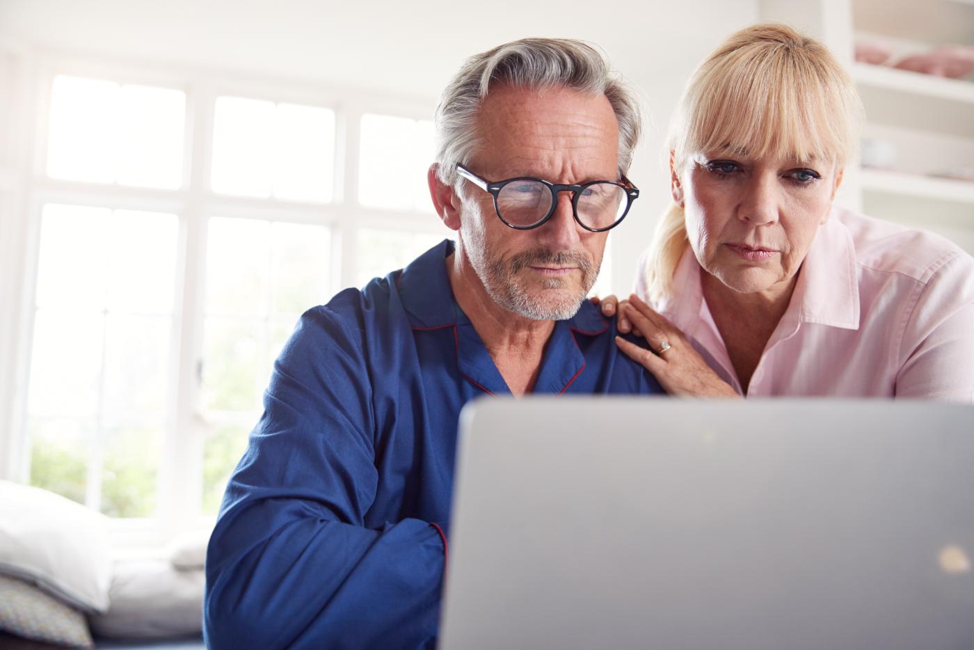 Senior Couple on Couch with Laptop
