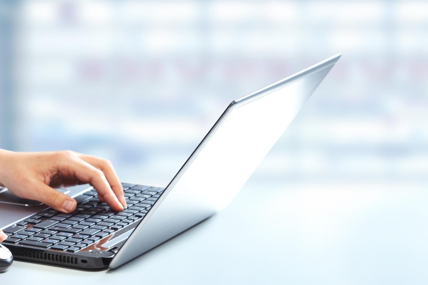 Hands using a laptop