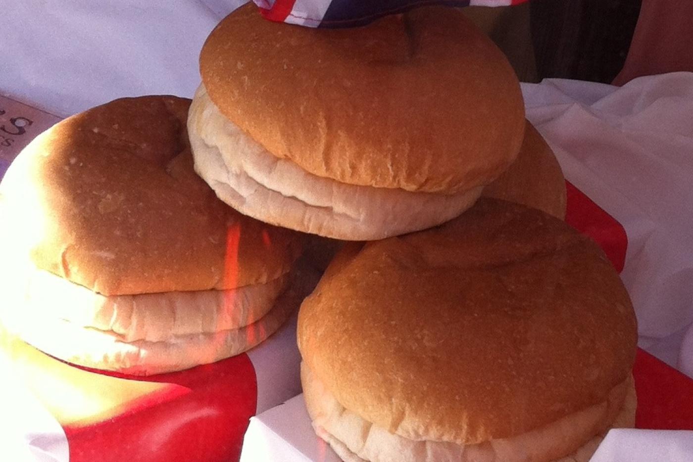 Three buns stacked on each other with British flag in the background.
