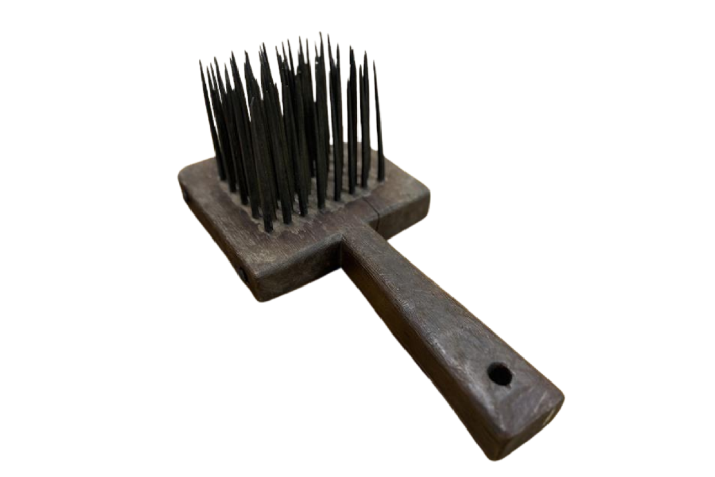wooden comb with sharp spikes