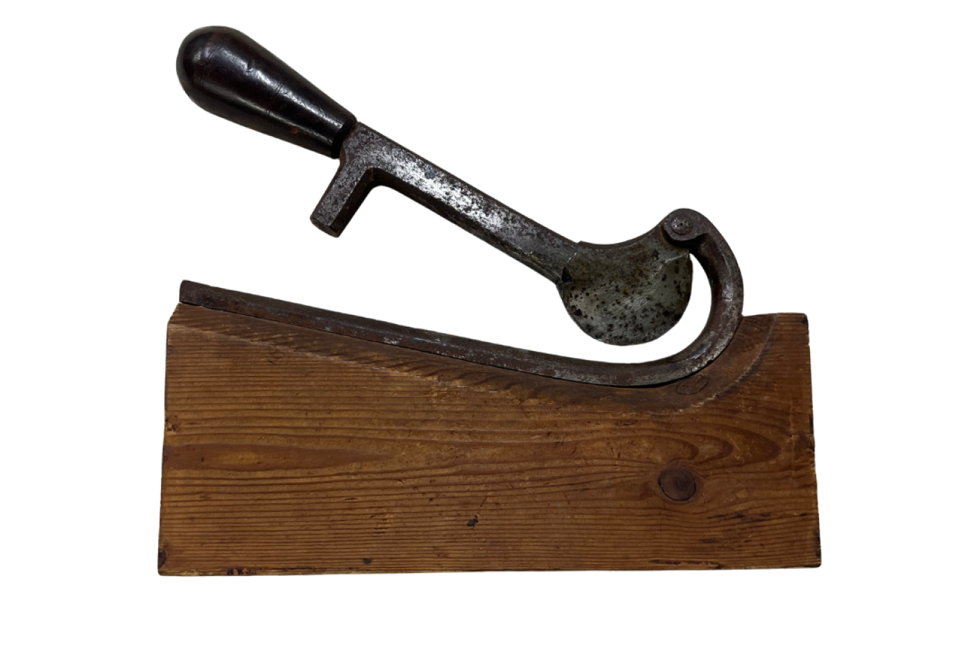 Metal tool attached to a wooden block