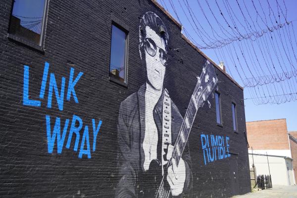 Mural of musician Link Wray playing guitar