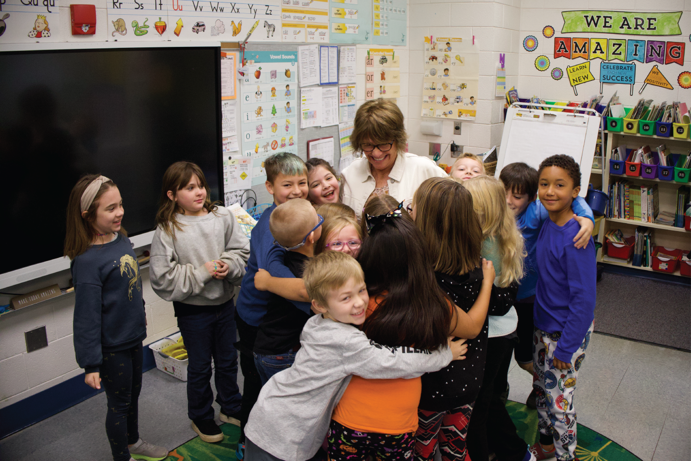 Students surrounding a teacher