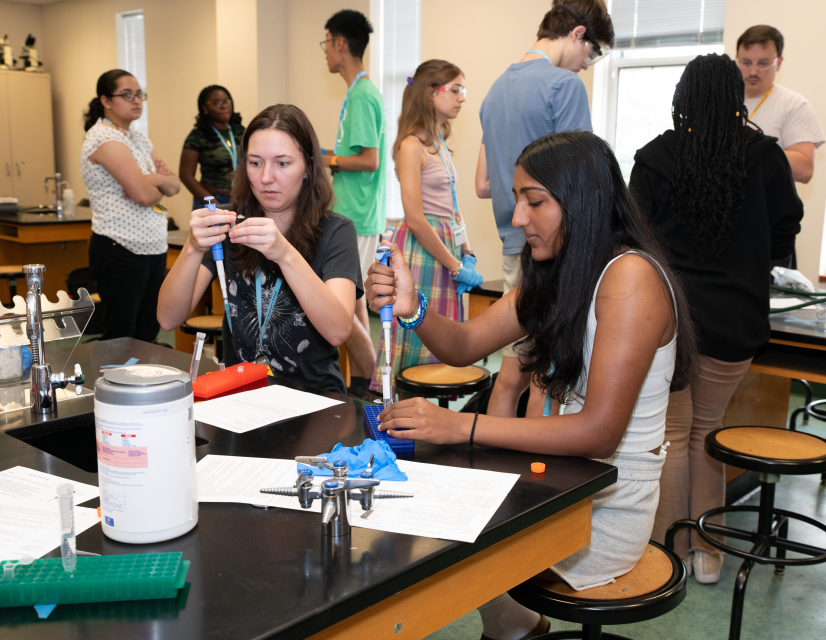 Two students doing a lab experiment in class.