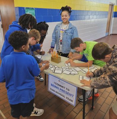 Students sign a pledge to be present in Nash County.